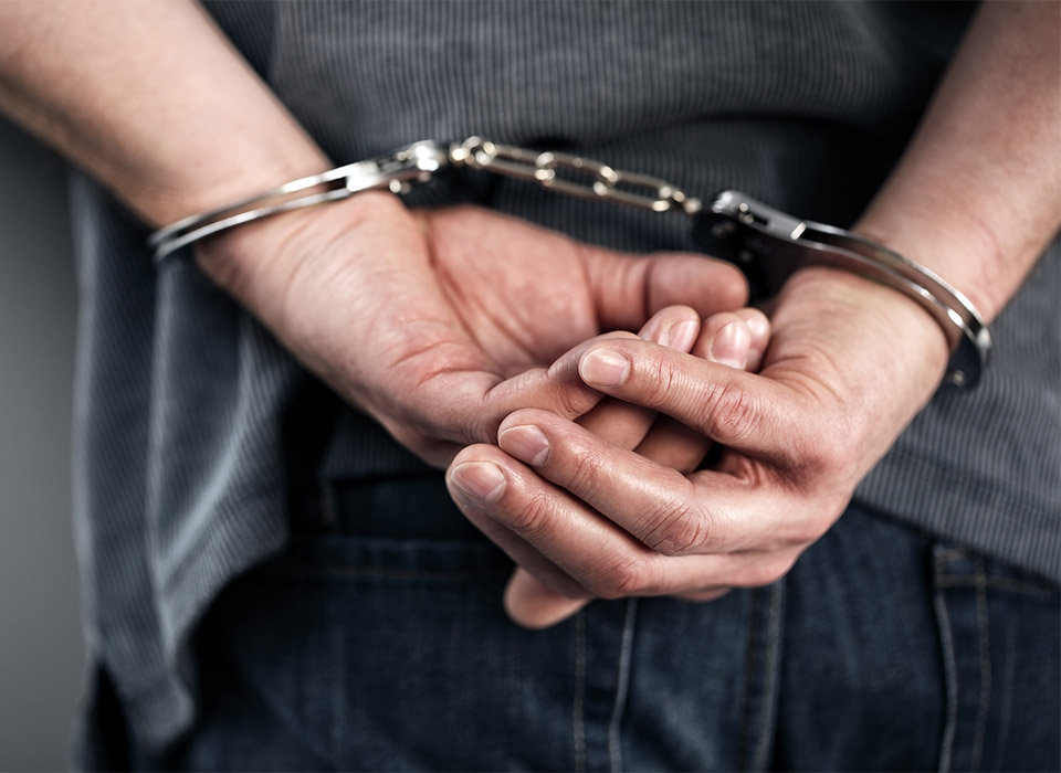 Man in handcuffs in Geelong needs advice form bail application lawyers